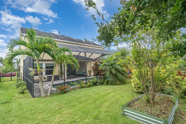 an aerial view of a house with a garden