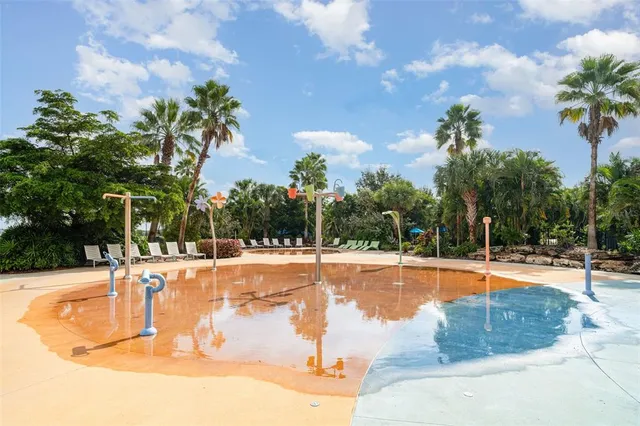 a view of swimming pool with a patio