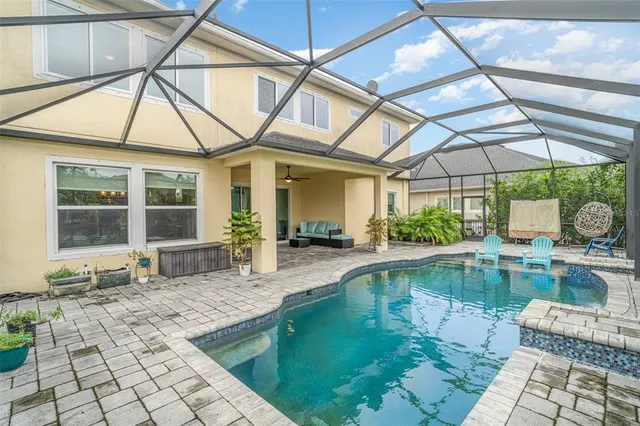 a kitchen with stainless steel appliances granite countertop a kitchen island hardwood floor and a sink