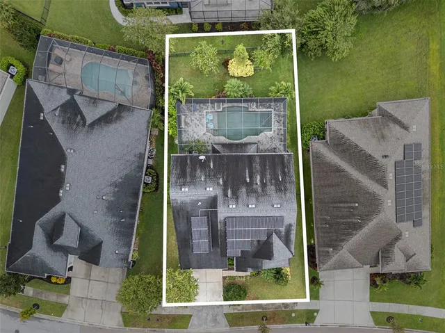 a kitchen with stainless steel appliances granite countertop a kitchen island a stove a table and chairs in it