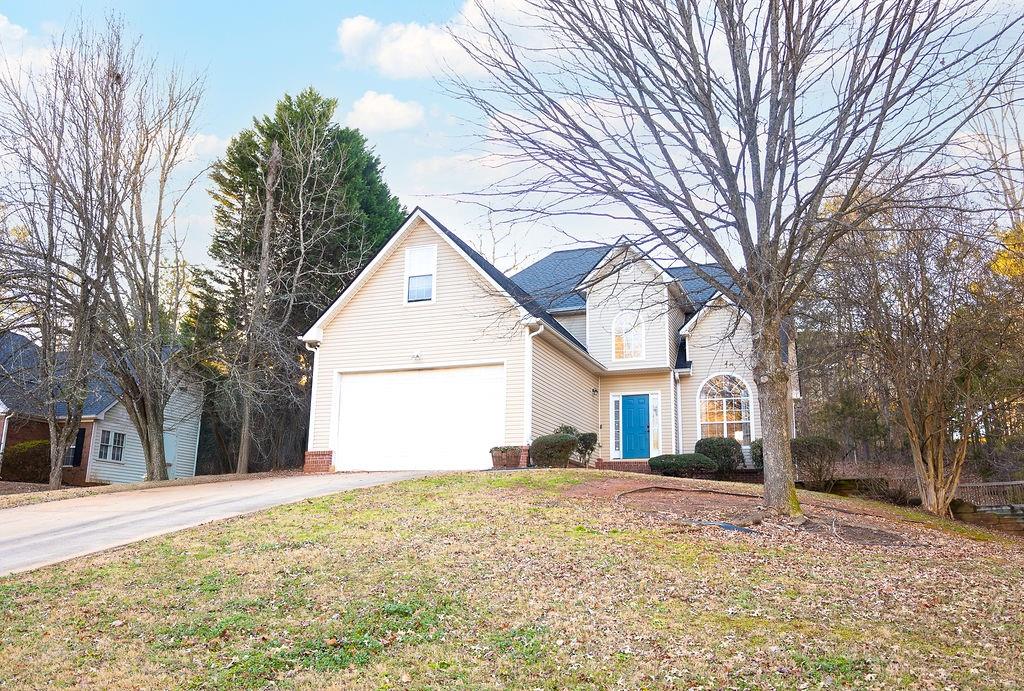 20 Cascade Court Covington, GA 30016 - Photo 1 of 1 a front view of house with garage and trees
