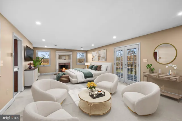 a kitchen with stainless steel appliances kitchen island granite countertop a table chairs and a refrigerator