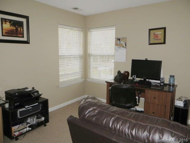 13412 Michael Lynn Road Charlotte, NC 28278 - Photo 16 of 16 a bedroom with a bed and a flat screen tv