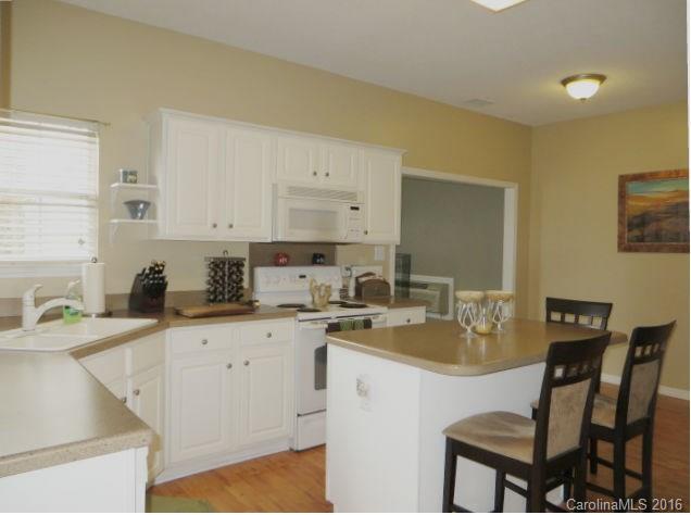 13412 Michael Lynn Road Charlotte, NC 28278 - Photo 5 of 16 a kitchen with a sink cabinets and wooden floor