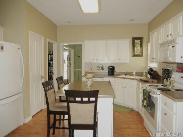 13412 Michael Lynn Road Charlotte, NC 28278 - Photo 6 of 16 a kitchen with appliances a sink and cabinets