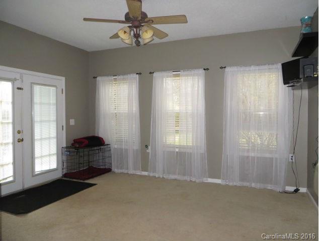 13412 Michael Lynn Road Charlotte, NC 28278 - Photo 7 of 16 a bedroom with windows closet and chandelier fan