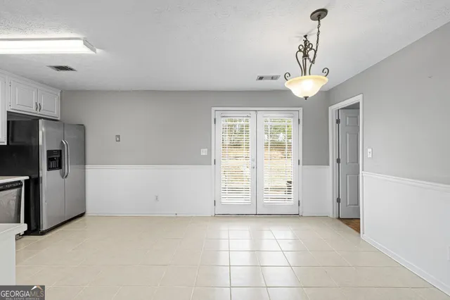 a kitchen with granite countertop a stove and a microwave oven
