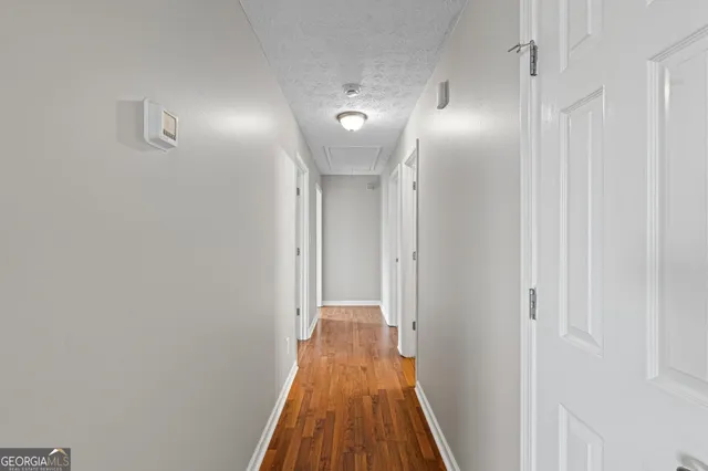 a bathroom with a toilet a sink a mirror a bathtub and vanity