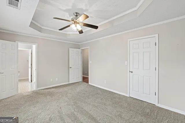 a bathroom with a tub sink double vanity and a mirror