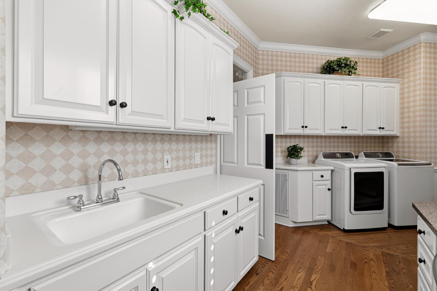 5869 Granite Hills Drive South Granite Bay, CA 95746 - Photo 34 of 66 a kitchen with white cabinets and white appliances