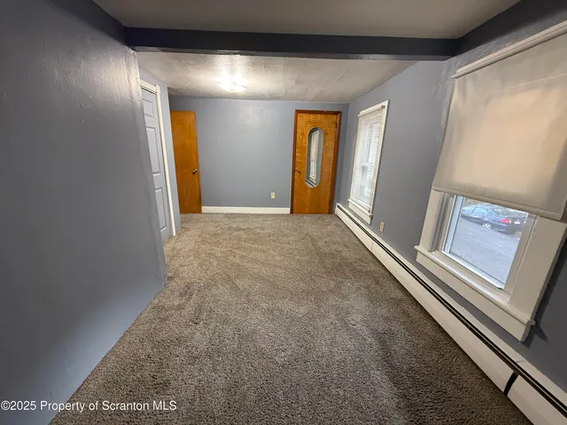 a view of an empty room and window