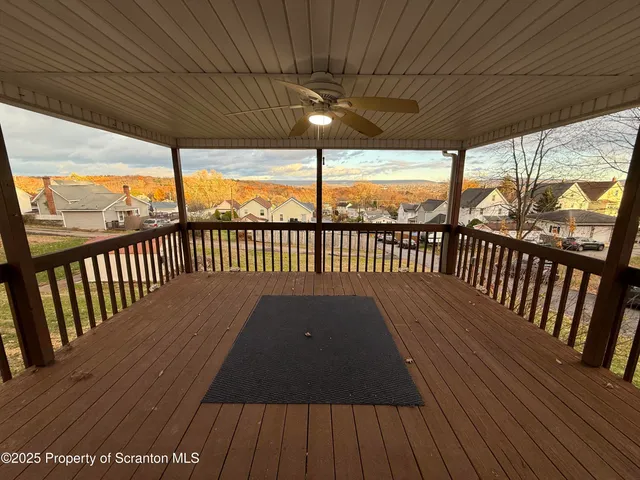 a view of balcony with wooden floor