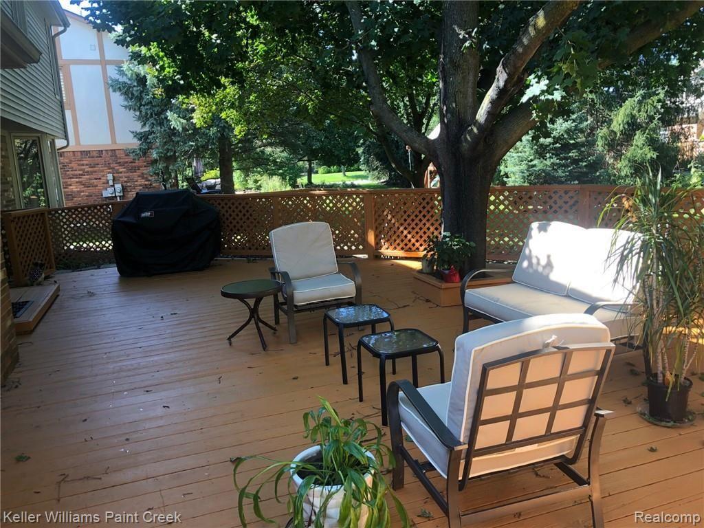 Summer picture of deck in back yard.