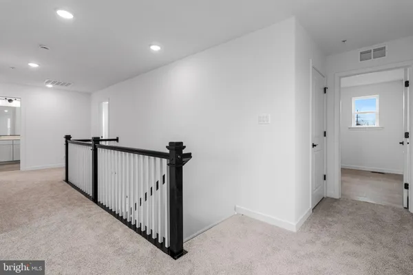a view of a hallway with a room