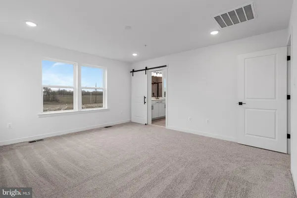 a large white bathroom with a double vanity sink mirror and