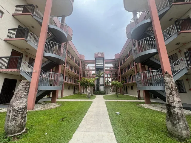 a view of buildings with garden