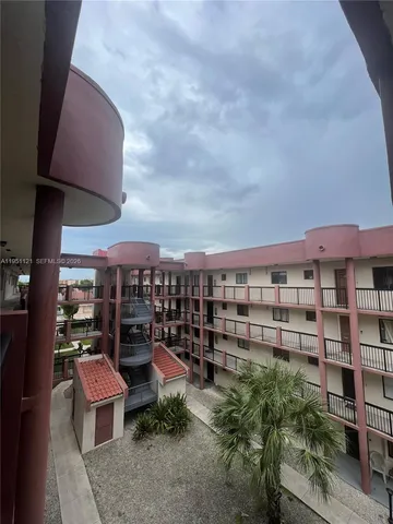 a view of a chairs and table in the patio