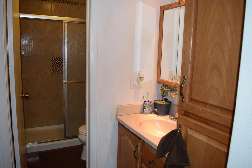 70 Evergreen Road, Unit 103 Dillon, CO 80435 - Photo 6 of 8 a bathroom with a sink and a mirror