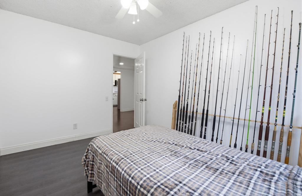 421 Hillcrest Lane Fallbrook, CA 92028 - Photo 16 of 32 a bedroom with a bed and a chandelier