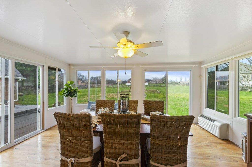 619 Lee Road Lebanon, TN 37087 - Photo 16 of 19 a dining room with furniture a chandelier and wooden floor
