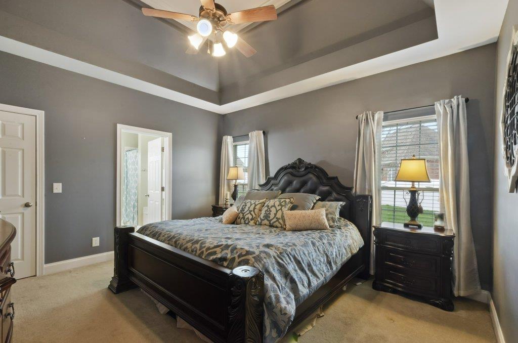 619 Lee Road Lebanon, TN 37087 - Photo 8 of 19 a bedroom with a bed and a chandelier