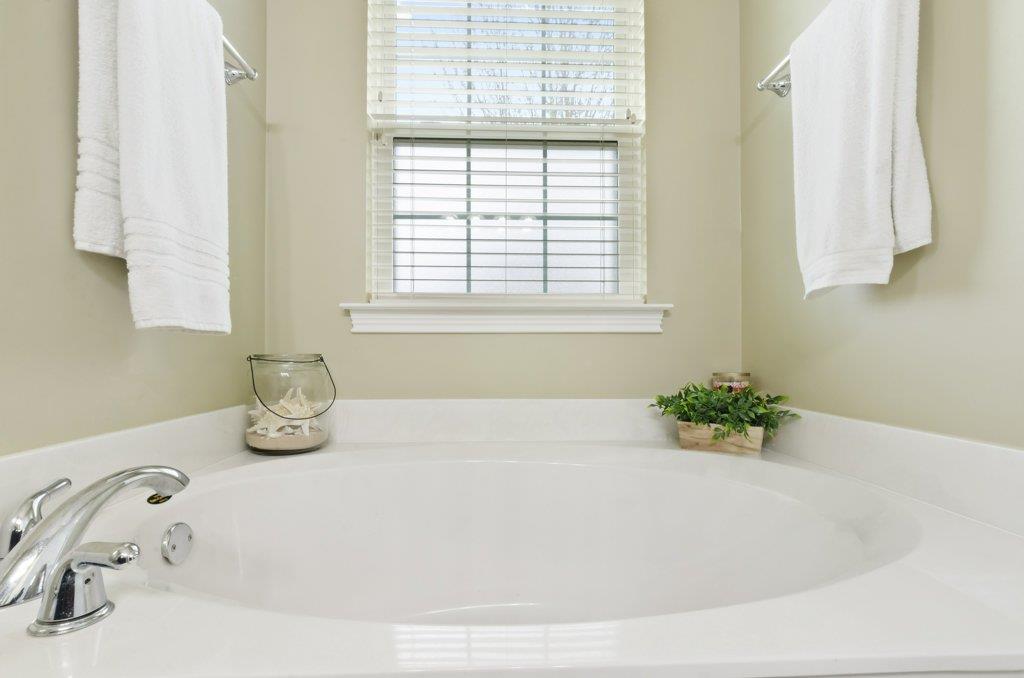 619 Lee Road Lebanon, TN 37087 - Photo 10 of 19 a white bath tub sitting in a bathroom next to a window