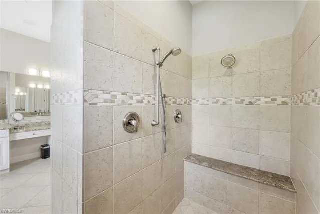 a bathroom with a shower and a sink