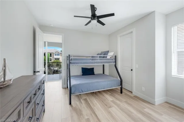 a living room with a bed furniture and a window