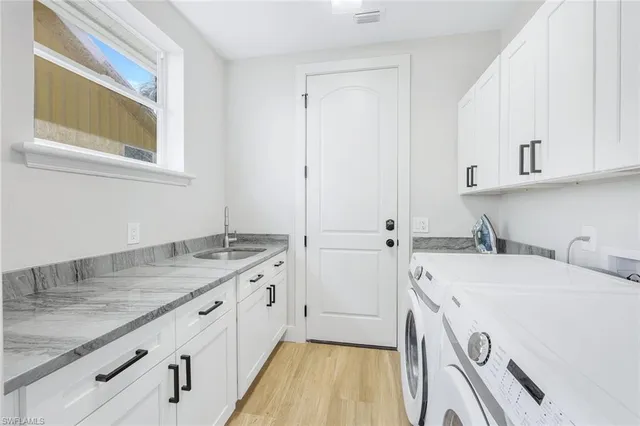a view of a kitchen with sink dishwasher and microwave