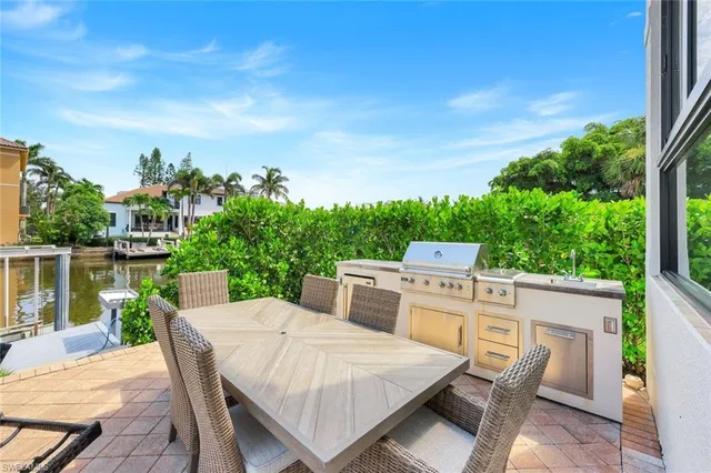 a view of a dinning tables and chairs in the patio