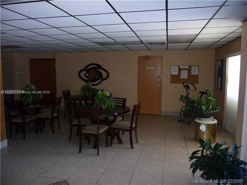 2200 East Hallandale Beach Boulevard, Unit 708 Hallandale Beach, FL 33009 - Photo 13 of 14 a view of a dinning room with furniture