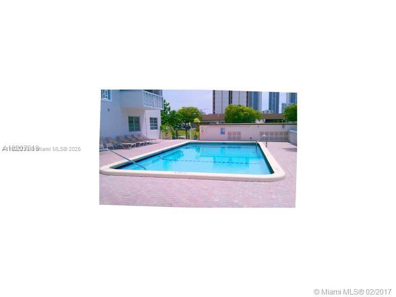 2200 East Hallandale Beach Boulevard, Unit 708 Hallandale Beach, FL 33009 - Photo 14 of 14 a picture of a living room with a small yard