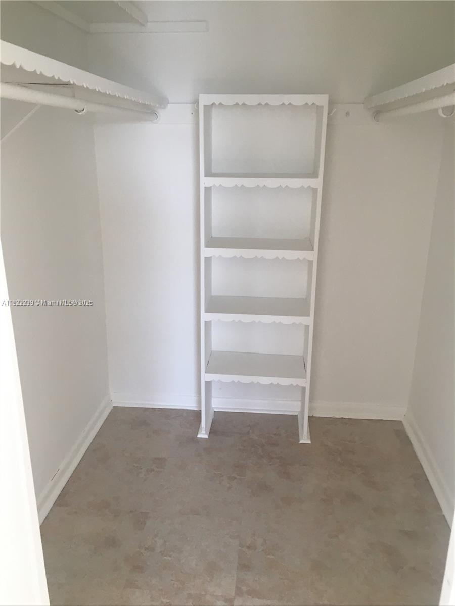 2200 East Hallandale Beach Boulevard, Unit 708 Hallandale Beach, FL 33009 - Photo 9 of 14 a view of an empty walk in closet