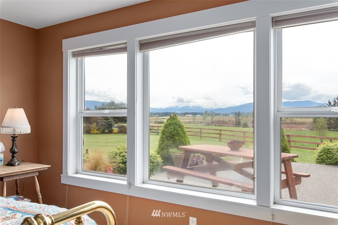 7351 Thiel Road Lynden, WA 98264 - Photo 14 of 33 a view of a room that has a bed and glass door