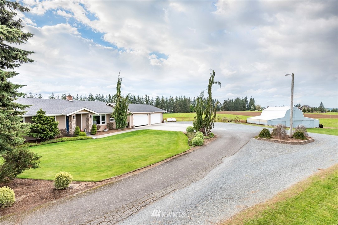 7351 Thiel Road Lynden, WA 98264 - Photo 33 of 33 a view of a garden with houses
