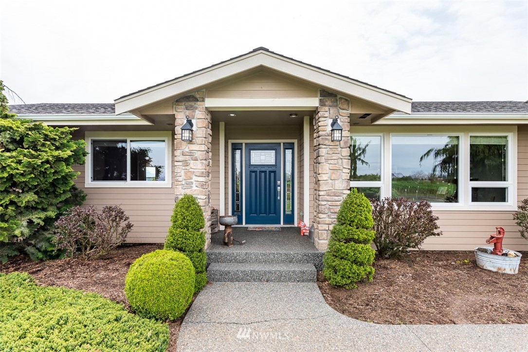 7351 Thiel Road Lynden, WA 98264 - Photo 5 of 33 front view of a house with potted plants