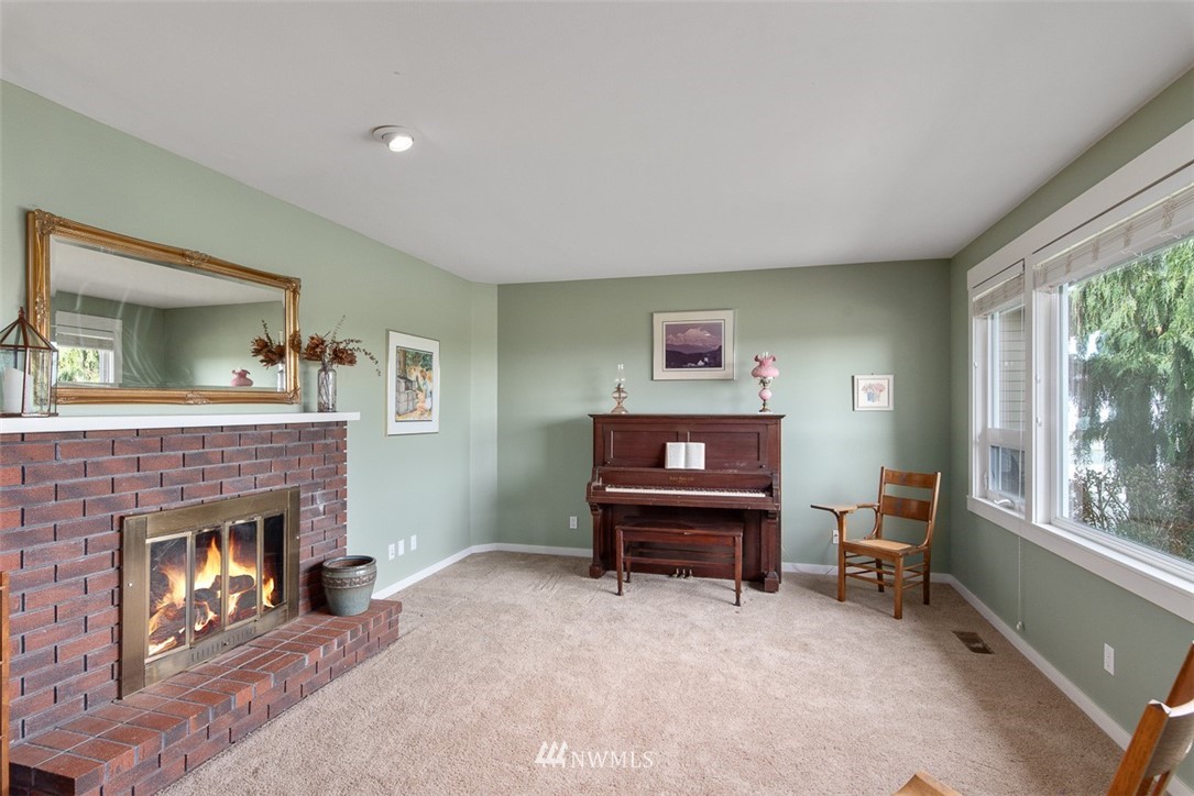 7351 Thiel Road Lynden, WA 98264 - Photo 7 of 33 a living room with furniture and a fireplace