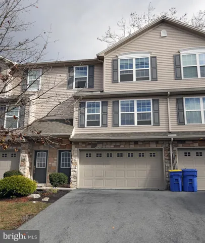 a front view of a building with garage