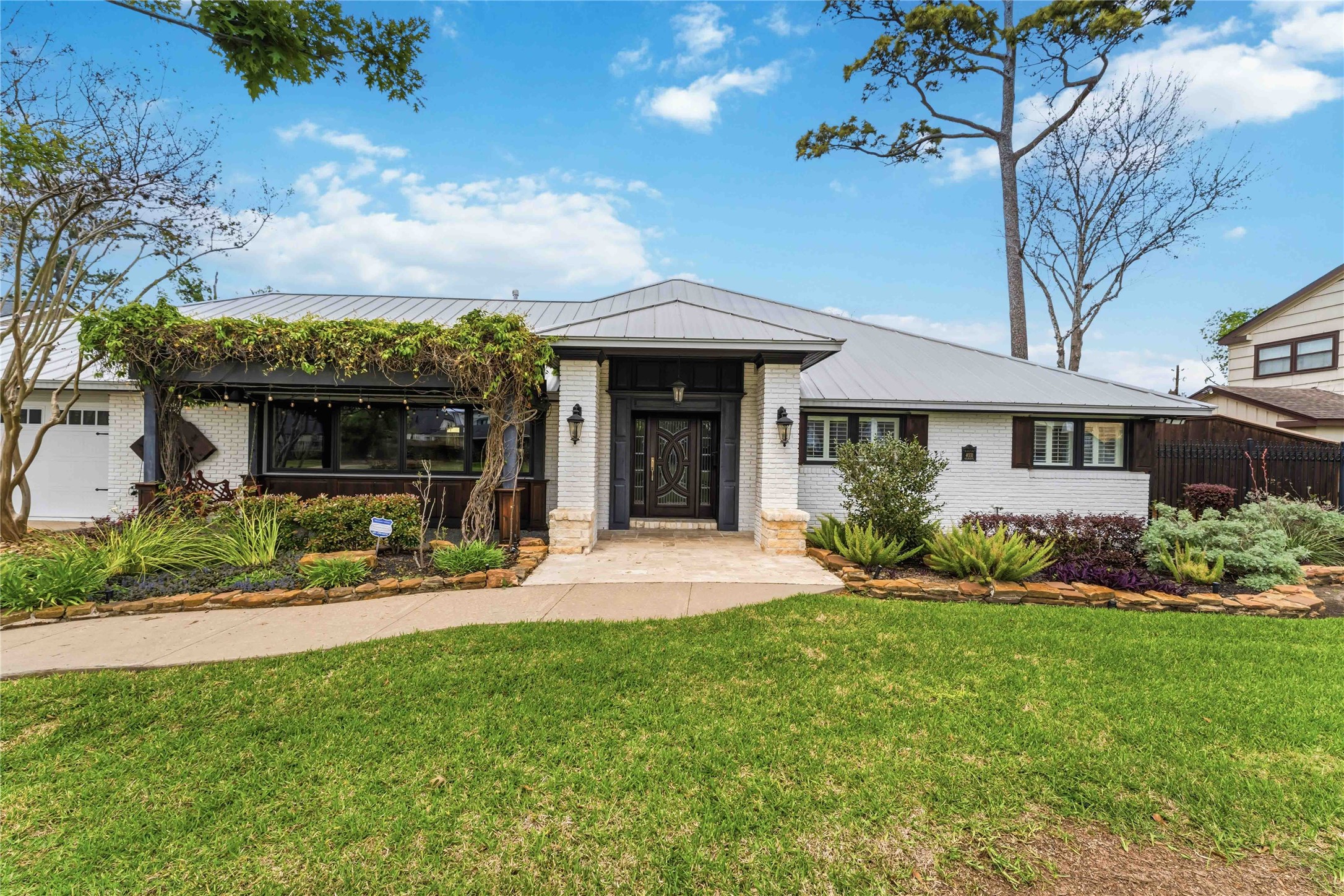 4031 Fernwood Drive Houston, TX 77021 - Photo 1 of 34 a view of a house with a yard and plants