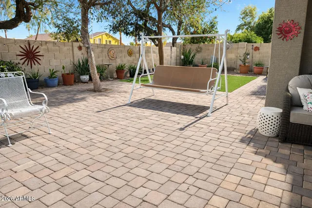 a view of a park with iron fence