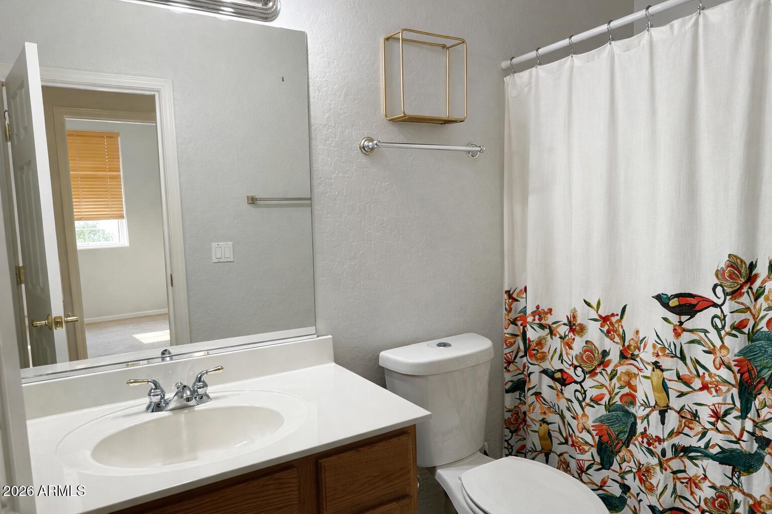 783 South Longmore Street Chandler, AZ 85224 - Photo 10 of 12 a bathroom with a sink toilet and shower