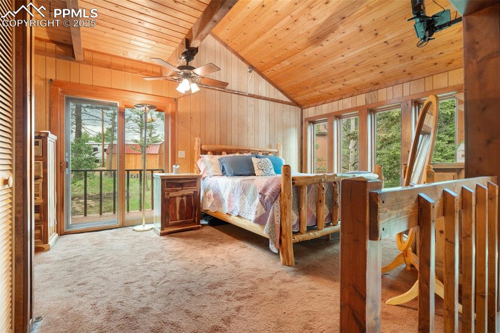 351 Porphry Road Florissant, CO 80816 - Photo 12 of 39 a bedroom with a bed and large window