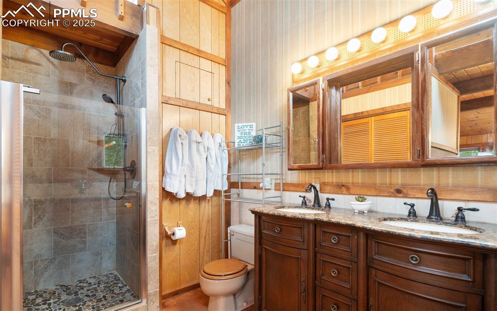 351 Porphry Road Florissant, CO 80816 - Photo 13 of 39 a bathroom with a granite countertop sink toilet and shower