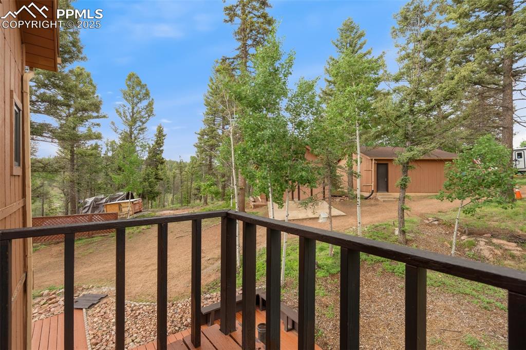 351 Porphry Road Florissant, CO 80816 - Photo 16 of 39 a view of a wooden deck and a forest