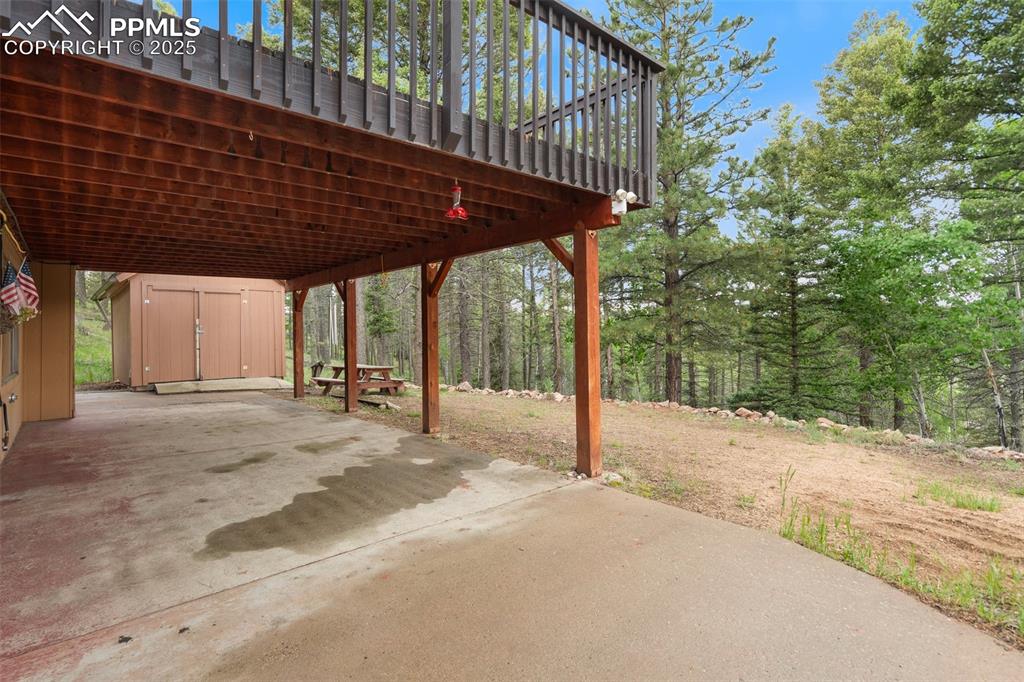 351 Porphry Road Florissant, CO 80816 - Photo 22 of 39 a backyard of a house with table and chairs