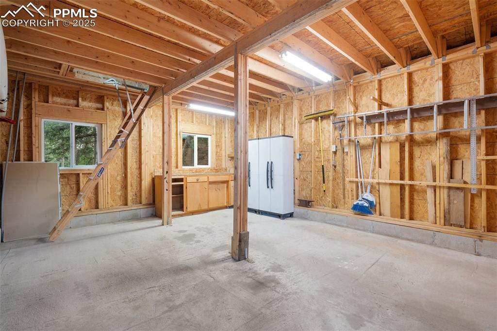 351 Porphry Road Florissant, CO 80816 - Photo 34 of 39 a view of an empty room with wooden walls