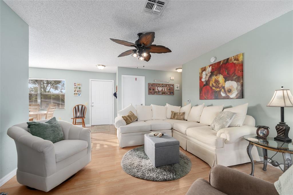 21373 Southwest Raintree Street Dunnellon, FL 34431 - Photo 13 of 39 a living room with furniture a rug and a window