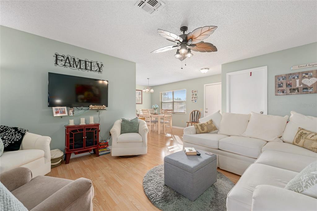 21373 Southwest Raintree Street Dunnellon, FL 34431 - Photo 15 of 39 a living room with furniture and a flat screen tv