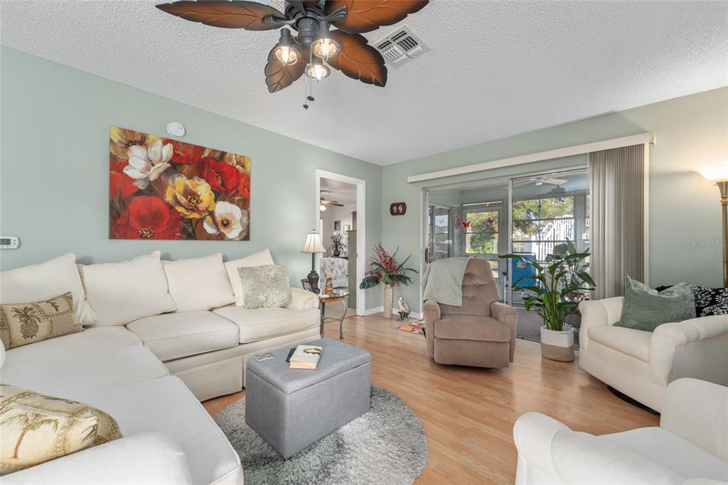 21373 Southwest Raintree Street Dunnellon, FL 34431 - Photo 16 of 39 a living room with furniture and a large window