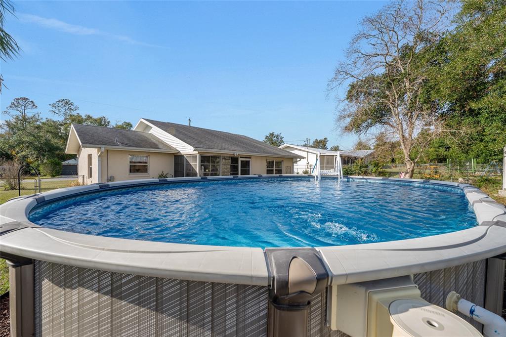 21373 Southwest Raintree Street Dunnellon, FL 34431 - Photo 2 of 39 a view of outdoor space yard and dinning table
